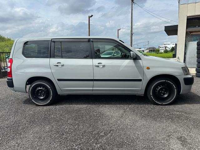 サクシードバン UL Xパッケージ 4WD グレー&マットブラック塗装 ホワイトレタータイヤ ウッド調ハンドル シートカバー 電動格納ドアミラー ナビ Bluetooth バックカメラ TV ETC(6枚目)