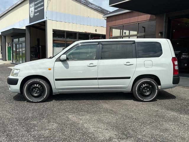 サクシードバン UL Xパッケージ 4WD グレー&マットブラック塗装 ホワイトレタータイヤ ウッド調ハンドル シートカバー 電動格納ドアミラー ナビ Bluetooth バックカメラ TV ETC(10枚目)