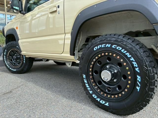 ジムニー XC 社外ナビ フルセグTV バックカメラ リフトアップ オーバーフェンダー ブラウンレザーシートカバー 16インチアルミホイール オープンカントリータイヤ 大型グリルガード リアラダー スペアタイヤカバー(32枚目)