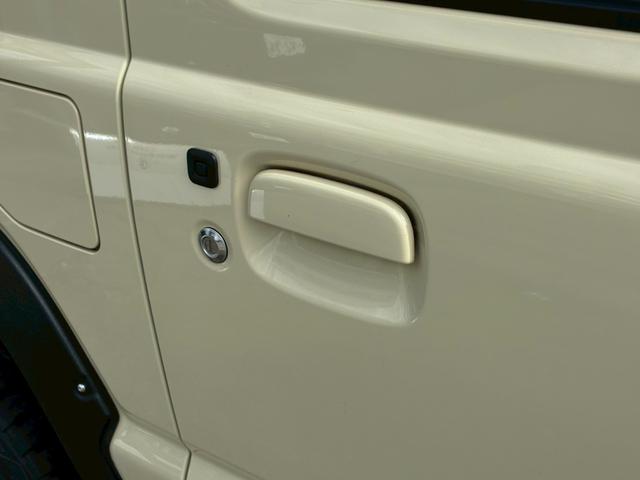 ジムニー ＸＣ　社外ナビ　フルセグＴＶ　バックカメラ　リフトアップ　オーバーフェンダー　ブラウンレザーシートカバー　１６インチアルミホイール　オープンカントリータイヤ　大型グリルガード　リアラダー　スペアタイヤカバー（20枚目）