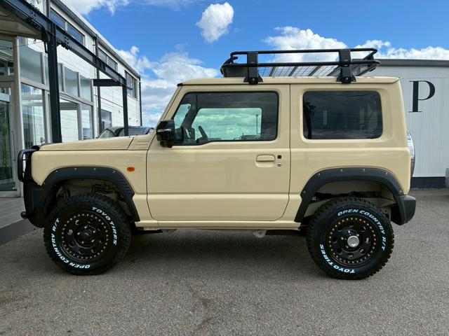 ジムニー ＸＣ　社外ナビ　フルセグＴＶ　バックカメラ　リフトアップ　オーバーフェンダー　ブラウンレザーシートカバー　１６インチアルミホイール　オープンカントリータイヤ　大型グリルガード　リアラダー　スペアタイヤカバー（35枚目）