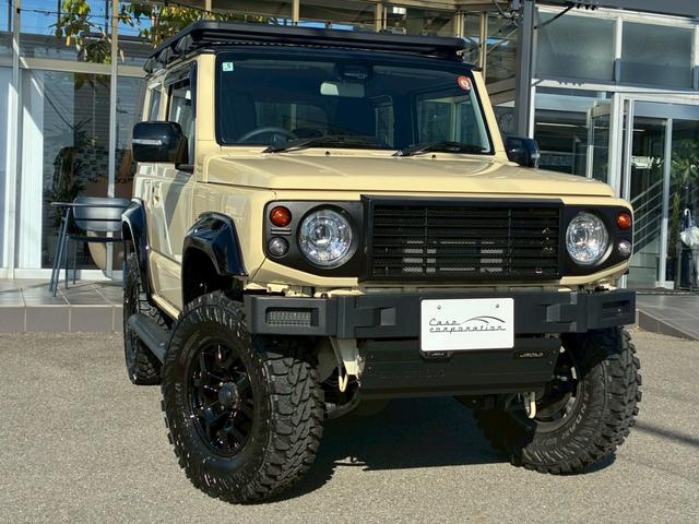 ジムニー XC 10インチディスプレイオーディオ オーバーフェンダー サイドステップ リフトアップ 15インチAW ジオランダータイヤ ディフェンダーグリル 黒レザーシートカバー リアラダー ショートバンパー(11枚目)