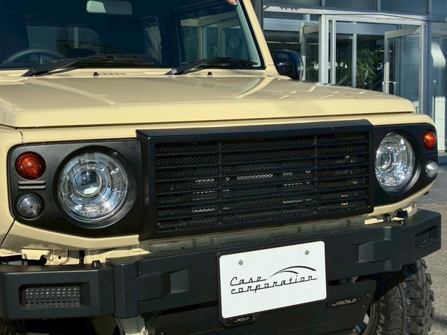 ジムニー XC 10インチディスプレイオーディオ オーバーフェンダー サイドステップ リフトアップ 15インチAW ジオランダータイヤ ディフェンダーグリル 黒レザーシートカバー リアラダー ショートバンパー(12枚目)