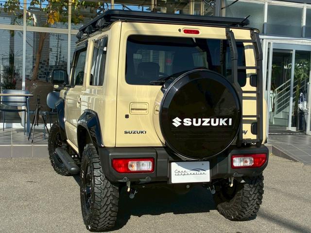 ジムニー XC 10インチディスプレイオーディオ オーバーフェンダー サイドステップ リフトアップ 15インチAW ジオランダータイヤ ディフェンダーグリル 黒レザーシートカバー リアラダー ショートバンパー(27枚目)