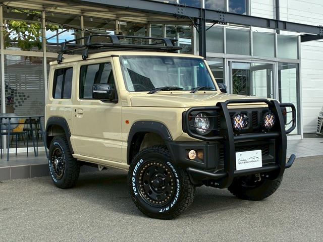 ジムニー ＸＣ　社外ナビ　フルセグＴＶ　バックカメラ　リフトアップ　オーバーフェンダー　ブラウンレザーシートカバー　１６インチアルミホイール　オープンカントリータイヤ　大型グリルガード　リアラダー　スペアタイヤカバー（10枚目）