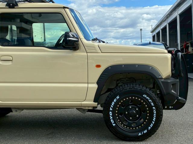 ジムニー ＸＣ　社外ナビ　フルセグＴＶ　バックカメラ　リフトアップ　オーバーフェンダー　ブラウンレザーシートカバー　１６インチアルミホイール　オープンカントリータイヤ　大型グリルガード　リアラダー　スペアタイヤカバー（23枚目）