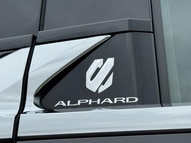 アルファードハイブリッド エグゼクティブラウンジ 内装ニュートラルベージュ 14型コネクトナビ JBLプレミアムサウンド リヤエンターテイメント デジタルミラー 左右独立ムーンルーフ CD/DVDデッキ スペアタイヤ 置くだけ充電 純正19インチAW(24枚目)