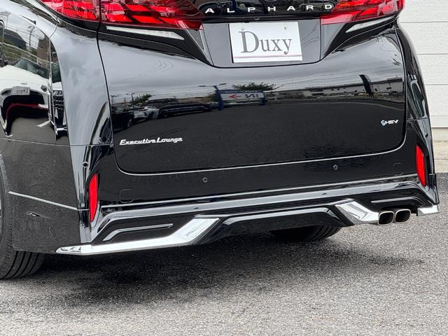 アルファードハイブリッド エグゼクティブラウンジ 内装ニュートラルベージュ 14型コネクトナビ JBLプレミアムサウンド リヤエンターテイメント デジタルミラー 左右独立ムーンルーフ CD/DVDデッキ スペアタイヤ 置くだけ充電 純正19インチAW(28枚目)