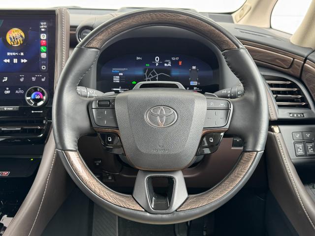 アルファードハイブリッド エグゼクティブラウンジ 内装ニュートラルベージュ 14型コネクトナビ JBLプレミアムサウンド リヤエンターテイメント デジタルミラー 左右独立ムーンルーフ CD/DVDデッキ スペアタイヤ 置くだけ充電 純正19インチAW(46枚目)