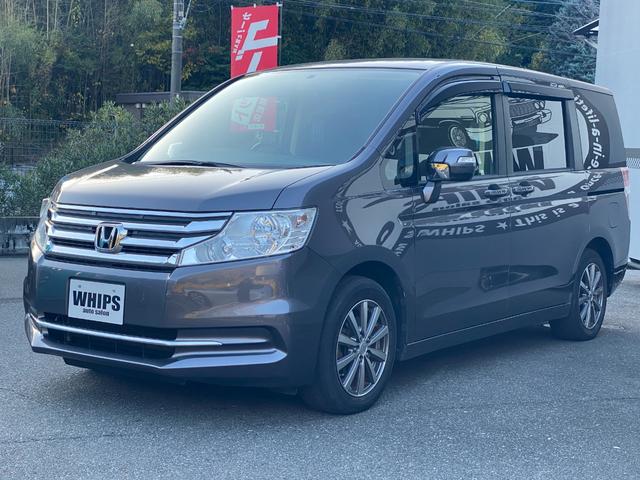 ステップワゴン Ｇ　Ｅセレクション　９インチ純正ナビ　ＢＴ　バックカメラ　後部モニター　ＥＴＣ　クルコン　盗難防止装置　スマートキー　社外アルミホイール　電動格納ミラー　両側スライド片側電動ドア　三列シート　フルフラットシート（20枚目）