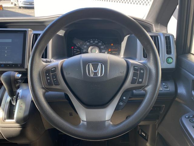 ステップワゴン Ｇ　Ｅセレクション　９インチ純正ナビ　ＢＴ　バックカメラ　後部モニター　ＥＴＣ　クルコン　盗難防止装置　スマートキー　社外アルミホイール　電動格納ミラー　両側スライド片側電動ドア　三列シート　フルフラットシート（21枚目）