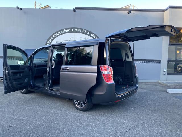 ステップワゴン Ｇ　Ｅセレクション　９インチ純正ナビ　ＢＴ　バックカメラ　後部モニター　ＥＴＣ　クルコン　盗難防止装置　スマートキー　社外アルミホイール　電動格納ミラー　両側スライド片側電動ドア　三列シート　フルフラットシート（64枚目）