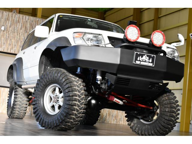 サファリ グランロードリミテッド　切替４ＷＤ　１ナンバー４人乗り　リフトアップ　ＡＲＢ作業灯　社外１６ＡＷ　マッドタイヤ　ワンオフマフラー　社外ステアリング　ＬＥＤテール　アイアンバンパー　ＥＴＣ　ＨＤＤナビ　地デジ　ＢＴ　ＤＶＤ（5枚目）