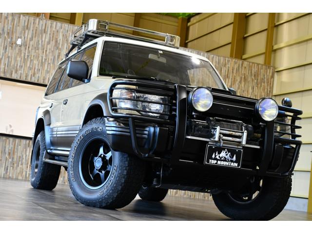 ワイド　エクシード　切替４ＷＤ　ベージュ全塗装　サンルーフ　ルーフキャリア　アイバワークスルーフラック　グリルガード　ＥＮＫＥＩ１６インチＡＷ　リアラダー　ＰＩＡＡフロントフォグ　背面タイヤ　社外ステアリング　ＥＴＣ(5枚目)