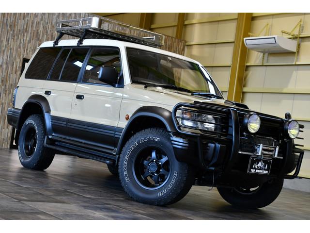 ワイド　エクシード　切替４ＷＤ　ベージュ全塗装　サンルーフ　ルーフキャリア　アイバワークスルーフラック　グリルガード　ＥＮＫＥＩ１６インチＡＷ　リアラダー　ＰＩＡＡフロントフォグ　背面タイヤ　社外ステアリング　ＥＴＣ(20枚目)