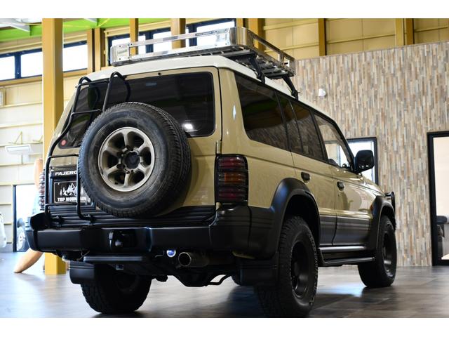 パジェロ ワイド　エクシード　切替４ＷＤ　ベージュ全塗装　サンルーフ　ルーフキャリア　アイバワークスルーフラック　グリルガード　ＥＮＫＥＩ１６インチＡＷ　リアラダー　ＰＩＡＡフロントフォグ　背面タイヤ　社外ステアリング　ＥＴＣ（56枚目）