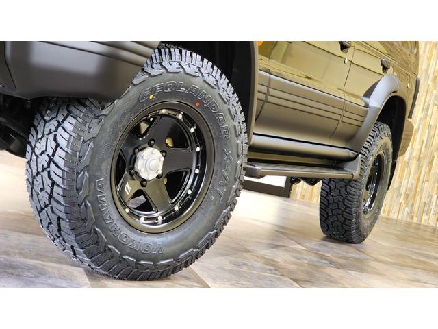 ワイド　エクシード　ディーゼルターボ　三菱ＯＰカラーエメラルドブラックパール全塗装済み　切替４ＷＤ　サンルーフ　リフトアップ　ＸＪ０５－１６インチ　ジオランダーＸ－ＡＴ　ダブルエアコン　キーレス　電格ミラー　ＥＴＣ(24枚目)