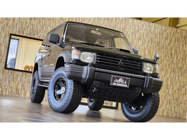 ワイド　エクシード　ディーゼルターボ　三菱ＯＰカラーエメラルドブラックパール全塗装済み　切替４ＷＤ　サンルーフ　リフトアップ　ＸＪ０５－１６インチ　ジオランダーＸ－ＡＴ　ダブルエアコン　キーレス　電格ミラー　ＥＴＣ(45枚目)