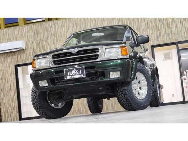 ベースグレード　切替４ＷＤ　５ＭＴ　　リフトアップ　ジムライン２ポリッシュ　ジオランダーＸ－ＡＴ　オレンジコーナー　ルーフレール　　３列シート　リアオープンガラスハッチ(47枚目)