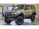 ランドクルーザー８０ ＶＸリミテッド　４ＷＤ　サンルーフ　サンドカーキ全塗装　リフトアップ　ジムライン　ジオランダーＸ－ＡＴ　社外オーバーフェンダー　シュノーケル　角目ヘッド　バンパーガード　ＨＤＤナビ　革シート　シートヒーター　ＥＴＣ（2枚目）