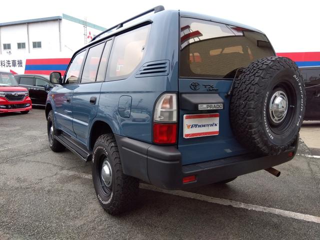 ランドクルーザープラド ＴＸリミテッド★４ＷＤ★ＦＬＥＸ仕様★３列シート★丸目ヘッド　ライト★シートカバー★ウッドパネル★キーレスキー★２ＤＩＮオーディオ★ＤＥＡＮクロスカントリー１６インチホイール★ＢＦグッドリッチＡＴホワイトリボンタイヤ★ルーフレール★サイドステップ★（12枚目）