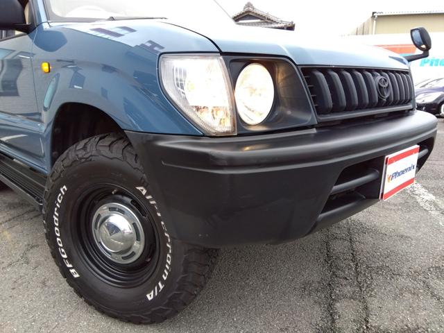 ランドクルーザープラド ＴＸリミテッド★４ＷＤ★ＦＬＥＸ仕様★３列シート★丸目ヘッド　ライト★シートカバー★ウッドパネル★キーレスキー★２ＤＩＮオーディオ★ＤＥＡＮクロスカントリー１６インチホイール★ＢＦグッドリッチＡＴホワイトリボンタイヤ★ルーフレール★サイドステップ★（22枚目）