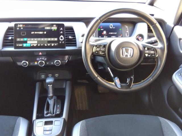 フィット ｅ：ＨＥＶ　ＲＳ★純正９インチナビフルセグＴＶ★ホンダセンシ　ング★ＬＥＤオートライト★パドルシフト★ＳＯＳコール★革巻ステアリング★４輪ディスクブレーキ★ＲＳ専用エクステリア★アームレストコンソール★レーダークルーズコントロール★ビルトインＥＴＣ２．０★（33枚目）
