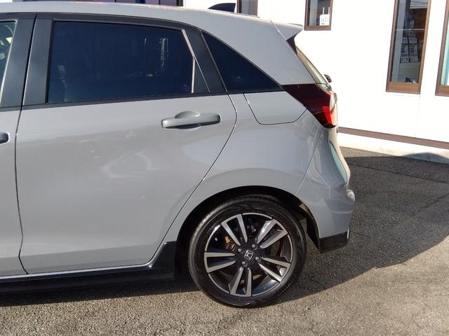 フィット ｅ：ＨＥＶ　ＲＳ★純正９インチナビフルセグＴＶ★ホンダセンシ　ング★ＬＥＤオートライト★パドルシフト★ＳＯＳコール★革巻ステアリング★４輪ディスクブレーキ★ＲＳ専用エクステリア★アームレストコンソール★レーダークルーズコントロール★ビルトインＥＴＣ２．０★（50枚目）