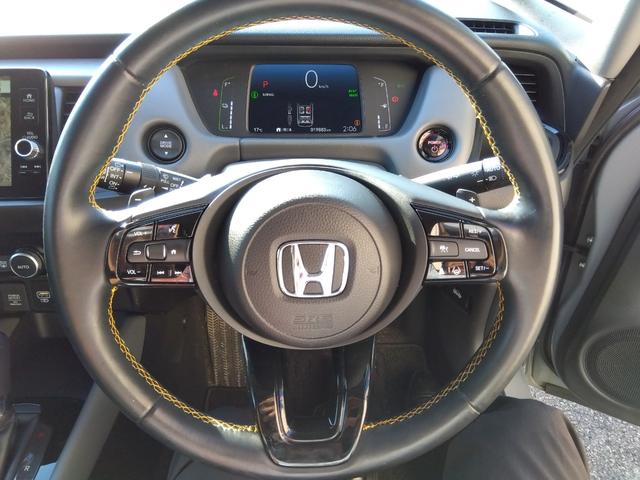 フィット ｅ：ＨＥＶ　ＲＳ★純正９インチナビフルセグＴＶ★ホンダセンシ　ング★ＬＥＤオートライト★パドルシフト★ＳＯＳコール★革巻ステアリング★４輪ディスクブレーキ★ＲＳ専用エクステリア★アームレストコンソール★レーダークルーズコントロール★ビルトインＥＴＣ２．０★（64枚目）