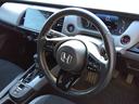 ｅ：ＨＥＶ　ＲＳ★純正９インチナビフルセグＴＶ★ホンダセンシ　ング★ＬＥＤオートライト★パドルシフト★ＳＯＳコール★革巻ステアリング★４輪ディスクブレーキ★ＲＳ専用エクステリア★アームレストコンソール★レーダークルーズコントロール★ビルトインＥＴＣ２．０★（26枚目）