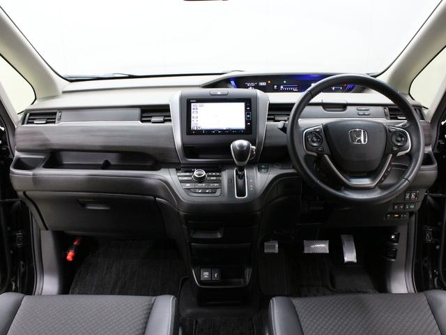 フリード Ｇ・ホンダセンシング　純正ナビ　両側パワスラ　ハーフレザー　本革巻きステアリング　ＬＥＤアクティブコーナリングライト　純正１５インチＡＷ　オートリトラミラー　シートヒーター　スマートキー　シートヒータ　禁煙車　ワンオーナー（5枚目）