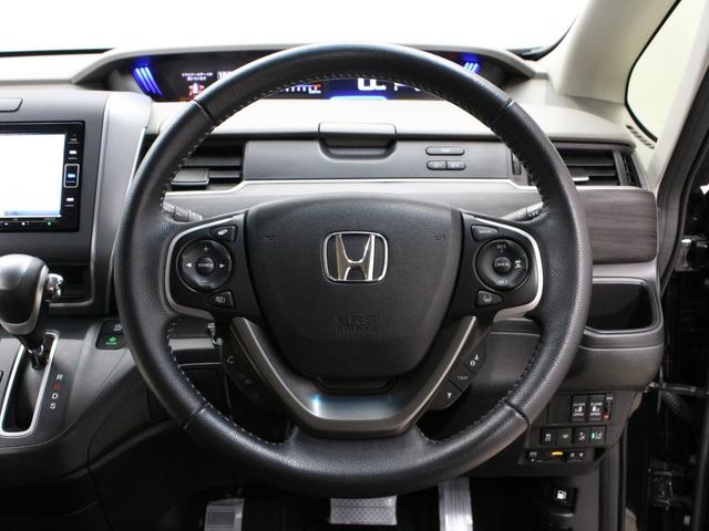 フリード Ｇ・ホンダセンシング　純正ナビ　両側パワスラ　ハーフレザー　本革巻きステアリング　ＬＥＤアクティブコーナリングライト　純正１５インチＡＷ　オートリトラミラー　シートヒーター　スマートキー　シートヒータ　禁煙車　ワンオーナー（12枚目）