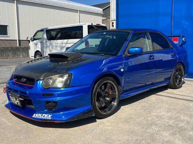 インプレッサ ＷＲＸ　ＳＴｉ　６速マニュアル　社外エキマニ　ＨＫＳキャタライザー　フジツボマフラー　チャージスピードカーボンボンネット　ＶＯＬＴＥＸバンパー　ＨＫＳ車高調　Ｄｅｆｉ追加メーター　ＳＳＲ１８インチアルミ　ブーコン（18枚目）