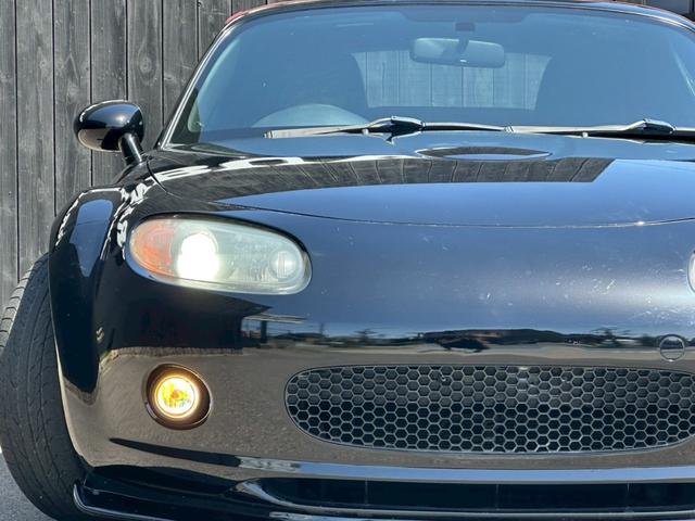 ロードスター ＲＳ　車高調キット　フロントサイドエアロパーツ　ＭＯＭＯステアリング　キーレスエントリー　社外マフラー　ＨＩＤヘッドライト　赤色ソフトトップ　ＥＴＣ　６速ＭＴ車両　純正１８インチアルミホイール　フォグライト（51枚目）