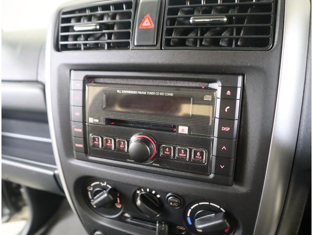ジムニー ワイルドウインド６型　目玉車　ＣＤプレーヤー・ＥＴＣ・マット　２ＤＩＮ　ＣＤプレーヤー（ラジオ・ＭＤ）　ＥＴＣ　トレータイプフロアマット　ドアバイザー　シートヒーター　キーレスエントリー　フロントフォグランプ　ルーフレール　スペアタイヤカバー　パートタイム４ＷＤ（12枚目）