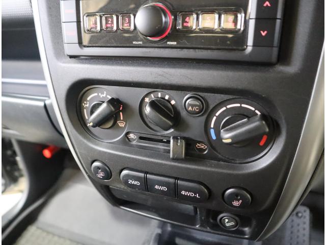 ジムニー ワイルドウインド６型　目玉車　ＣＤプレーヤー・ＥＴＣ・マット　２ＤＩＮ　ＣＤプレーヤー（ラジオ・ＭＤ）　ＥＴＣ　トレータイプフロアマット　ドアバイザー　シートヒーター　キーレスエントリー　フロントフォグランプ　ルーフレール　スペアタイヤカバー　パートタイム４ＷＤ（71枚目）