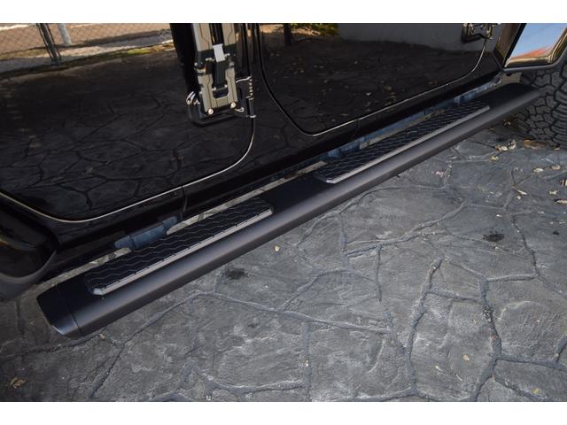 ジープ・ラングラーアンリミテッド サハラ　ブラックレザー　ジェプセン４本出しマフラー　スミティルーフラック　べストップサンライダー（ハードＴＯＰあり）　ルビコンホイール　ジオランダＸＡＴタイヤ　エルフォードフロントバンパー　ドラレコ（29枚目）