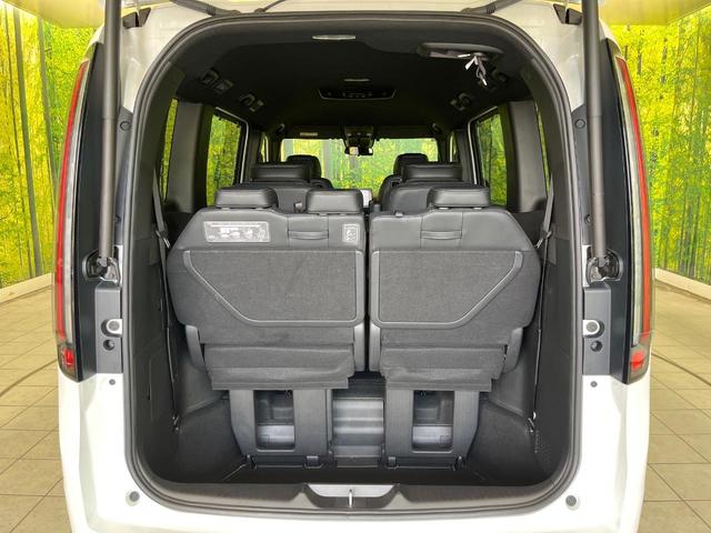 ステップワゴン ｅ：ＨＥＶスパーダ　プレミアムライン　禁煙車　純正９型ナビ　全周囲カメラ　衝突軽減　ＥＴＣ　Ｂｌｕｅｔｏｏｔｈ再生　両側電動スライドドア　パワーバックドア　ＢＳＭ　シートヒーター（前席中列）　オットマン　パドルシフト　シートバックテーブル（11枚目）