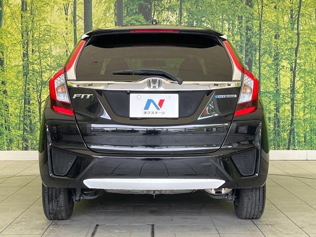 フィットハイブリッド Ｆパッケージ　コンフォートエディション　禁煙車　純正ＳＤナビ　バックカメラ　ＥＴＣ　シートヒーター　スマートキー　Ｂｌｕｔｏｏｔｈ接続　ＨＩＤヘッド　横滑り防止機能　オートエアコン　純正１５インチホイール　オートウィンドウ（15枚目）