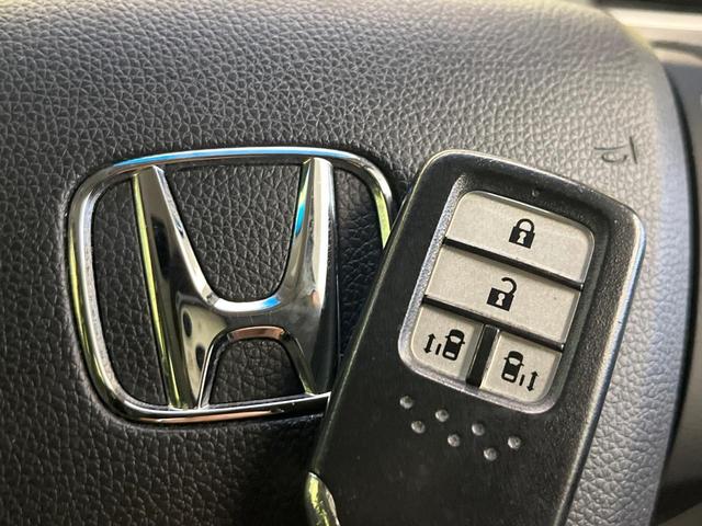 フリード G・ホンダセンシング 禁煙車 9型フローディングナビ フリップダウンモニター バックカメラ ETC フルセグTV スマートキー ホンダセンシング 両側電動スライドドア レーダークルーズ 純正15インチアルミ(38枚目)