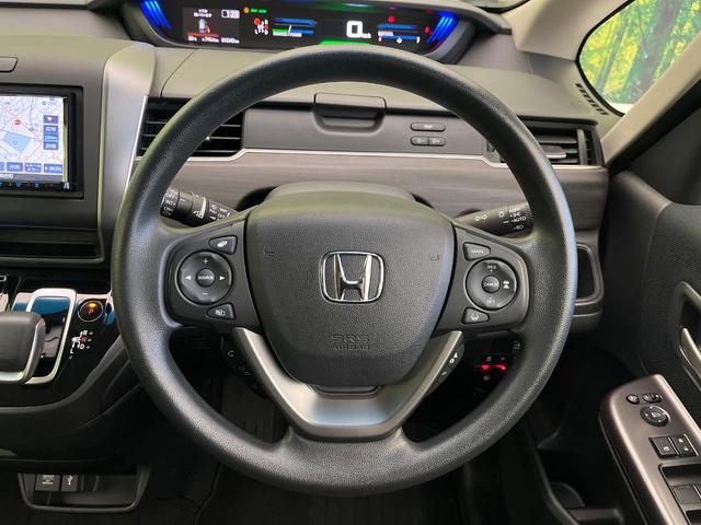 フリードハイブリッド ハイブリッド・Ｇブラックスタイル　禁煙車　ＳＤナビ　バックカメラ　ドラレコ　ＥＴＣ　Ｂｌｕｅｔｏｏｔｈ再生　シートヒーター（前席）　両側電動スライドドア　アダプティブクルーズ　ホンダセンシング　ＬＥＤヘッドライト　純正１５インチアルミ（12枚目）