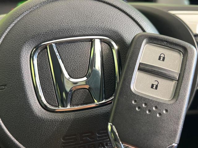 フィット ｅ：ＨＥＶベーシック　禁煙車　純正９型ナビ　バックカメラ　衝突被害軽減システム　レーダークルーズ　コーナーセンサー　スマートキー　ＬＥＤヘッド　ビルトインＥＴＣ　オートハイビーム　車線逸脱警報　オートライト　オートエアコン（51枚目）