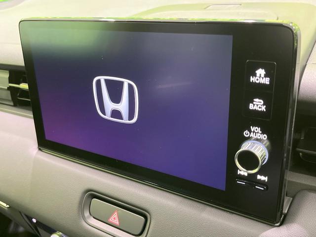 ヴェゼル ｅ：ＨＥＶ　Ｚ　登録済未使用車　純正９型ナビ　全周囲カメラ　ＥＴＣ２．０　Ｂｌｕｅｔｏｏｔｈ再生　ＢＳＭ　フルセグＴＶ　シートヒーター（前席）　パドルシフト　パワーバックドア　ハーフレザーシート　ステアリングヒーター（3枚目）