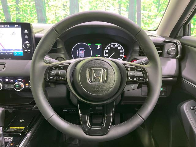 ヴェゼル ｅ：ＨＥＶ　Ｚ　登録済未使用車　純正９型ナビ　全周囲カメラ　ＥＴＣ２．０　Ｂｌｕｅｔｏｏｔｈ再生　ＢＳＭ　フルセグＴＶ　シートヒーター（前席）　パドルシフト　パワーバックドア　ハーフレザーシート　ステアリングヒーター（12枚目）