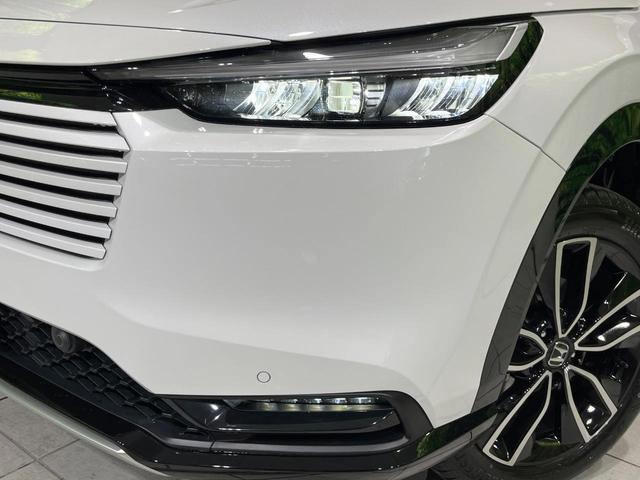 ヴェゼル ｅ：ＨＥＶ　Ｚ　登録済未使用車　純正９型ナビ　全周囲カメラ　ＥＴＣ２．０　Ｂｌｕｅｔｏｏｔｈ再生　ＢＳＭ　フルセグＴＶ　シートヒーター（前席）　パドルシフト　パワーバックドア　ハーフレザーシート　ステアリングヒーター（13枚目）