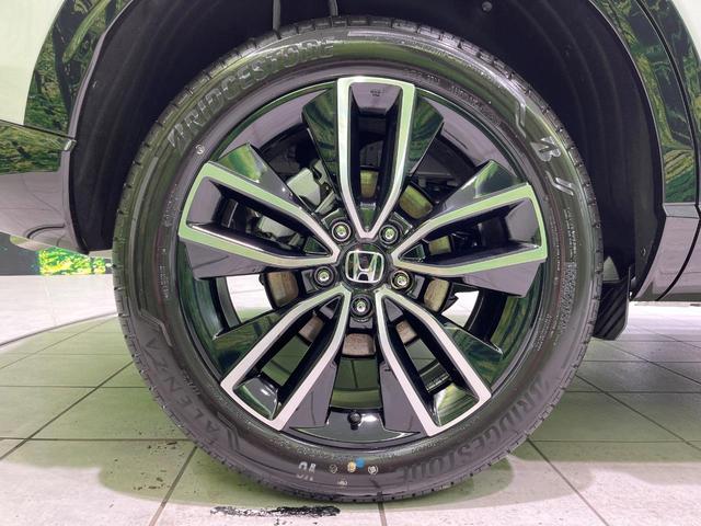 ヴェゼル ｅ：ＨＥＶ　Ｚ　登録済未使用車　純正９型ナビ　全周囲カメラ　ＥＴＣ２．０　Ｂｌｕｅｔｏｏｔｈ再生　ＢＳＭ　フルセグＴＶ　シートヒーター（前席）　パドルシフト　パワーバックドア　ハーフレザーシート　ステアリングヒーター（22枚目）