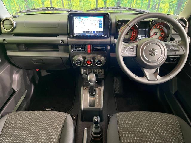 ジムニー ＸＣ　禁煙車　純正８型ナビ　バックカメラ　ＥＴＣ　Ｂｌｕｅｔｏｏｔｈ再生　シートヒーター（前席）　クルコン　コーナーセンサー　セーフティサポート　アイドリングストップ　スマートキー　オートエアコン（2枚目）