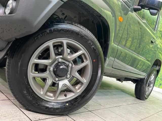 ジムニー ＸＣ　禁煙車　純正８型ナビ　バックカメラ　ＥＴＣ　Ｂｌｕｅｔｏｏｔｈ再生　シートヒーター（前席）　クルコン　コーナーセンサー　セーフティサポート　アイドリングストップ　スマートキー　オートエアコン（21枚目）
