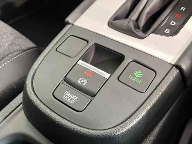 フィット e:HEVホーム 登録済未使用車 ホンダセンシング アダプティブクルーズ オートブレーキホールド オートエアコン スマートキー コーナーセンサー ハーフレザーシート LEDヘッドライト ステアリングスイッチ(5枚目)