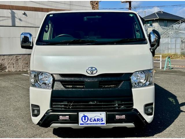 ハイエースバン スーパーＧＬ　ダークプライムＩＩ　２．８ＤＴスーパーＧＬダークプライムＩＩ　９インチワイドナビ・ＴＶ　デジタルインナーミラー　パノラマビュー　両側パワースライドドア　ＴＳＳ　社外１７ＡＷ　オープンカントリータイヤ　黒革調シートカバー（2枚目）